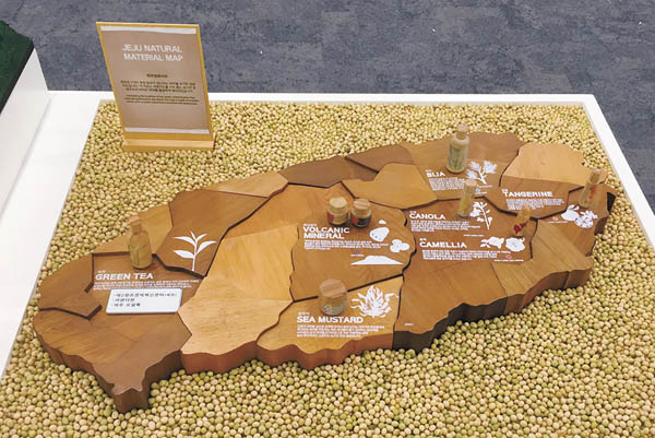 A miniature of Jeju Island shows a couple of villages growing AmorePacific’s cosmetics ingredients indigenous to island that will be developed into tourist attractions.