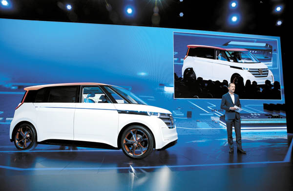 Volkswagen CEO Herbert Diess unveils the BUDD-e electric car during a keynote address at the CES. [AP] 