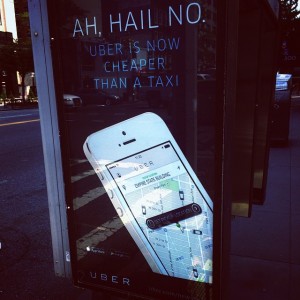 Uber advertisement at a bus stop shelter