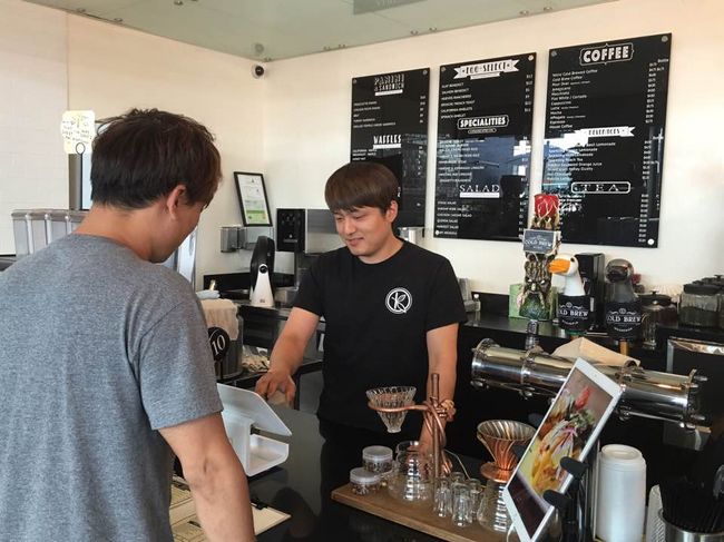 Increasing demand for higher quality coffee has drove up its price over the last couple of years. The picture above shows a customer making an order at Koreatown café Klat. 