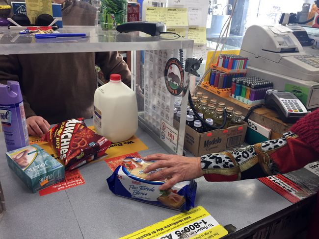The State Board of Equalization is becoming increasingly thorough with its screening process when monitoring taxes for various businesses. A customer at a market is making a purchase.