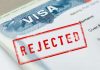 Student Visas Canceled for Minor Traffic Violations, 65+ Lawsuits Graphic of student visa with rejected stamp referencing traffic violation cancellations