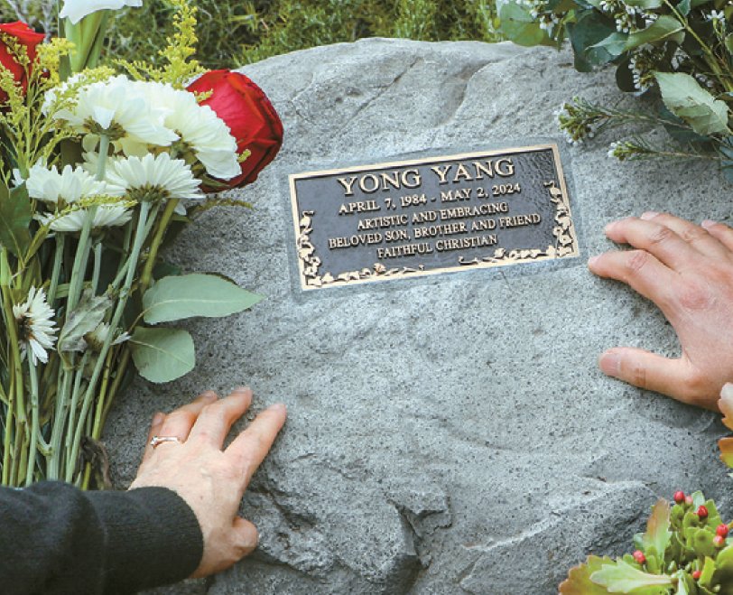 Parents of Yang Yong touch gravestone at Forest Lawn LAPD police shooting site