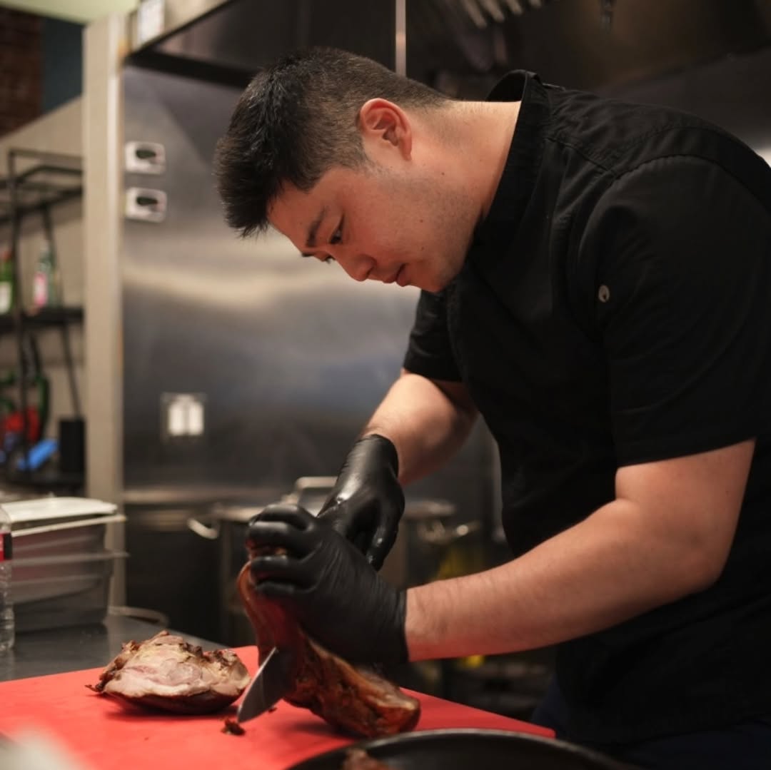 Chef Sungho slicing Jokbal at Sungho Korean restaurant in San Francisco