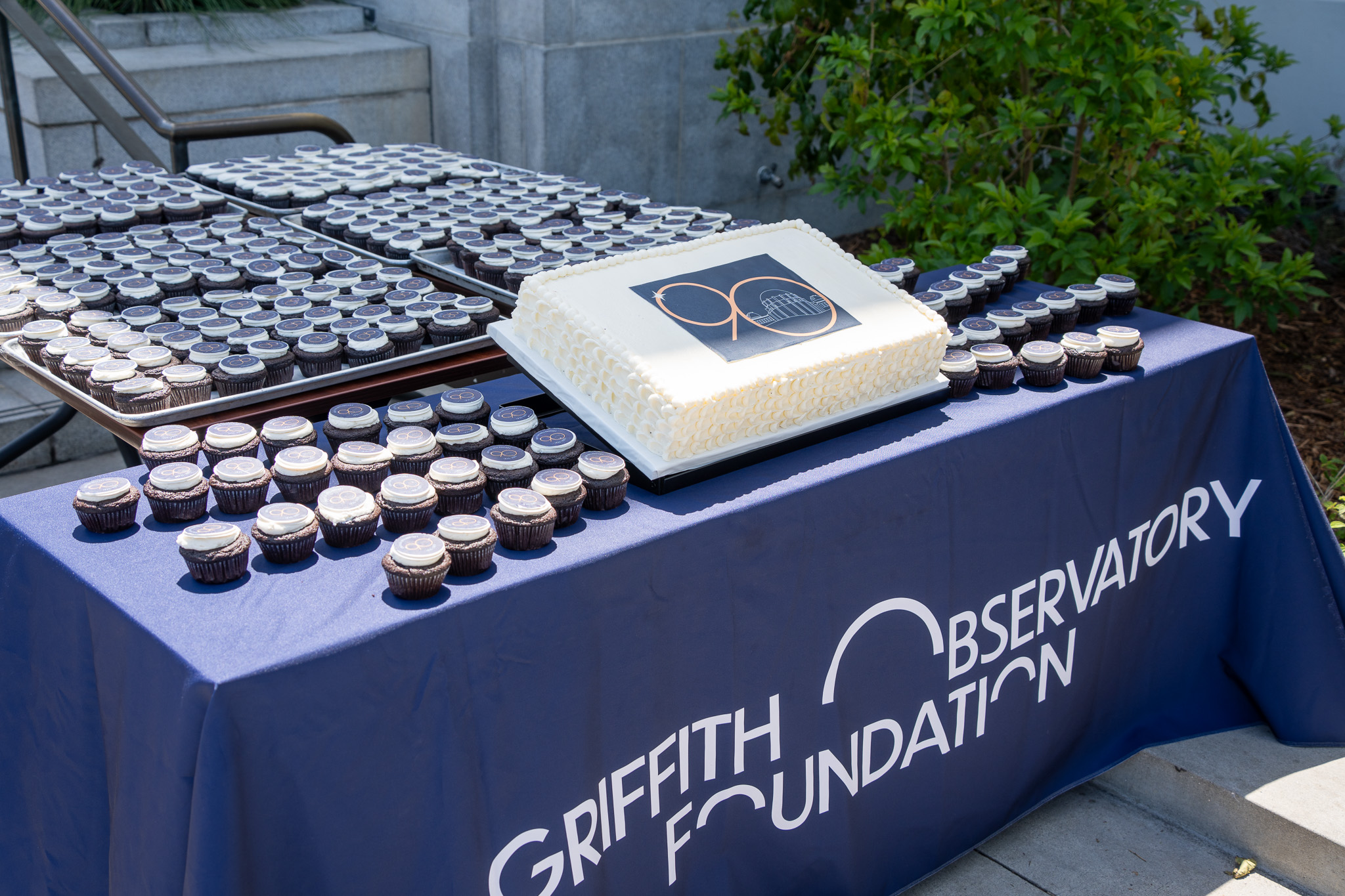 90th anniversary cake and muffins displayed at Griffith Observatory for visitors on May 14, 2025.