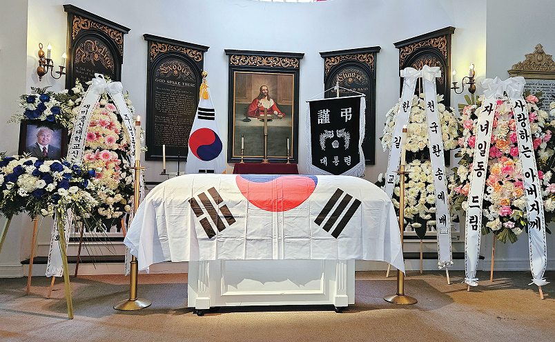Korean War veteran Jeong Kyoo-Sang’s funeral at Forest Lawn Hollywood Hills with presidential condolence banner displayed in background