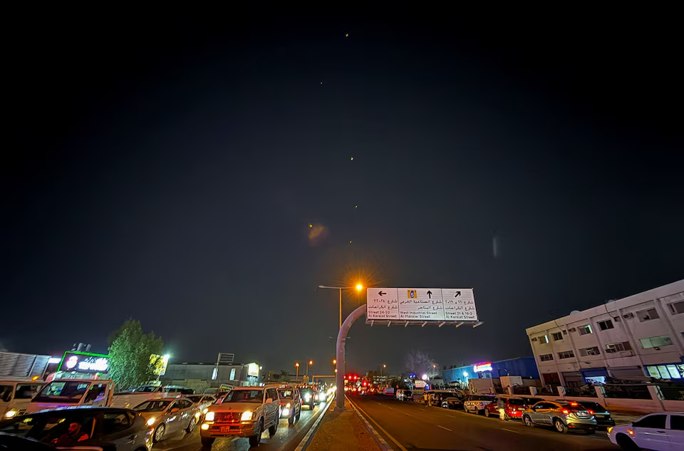 Missile trails over Doha after Iran targets U.S. base in Qatar amid escalating conflict