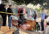 USC Study Shows $750 Cash Aid Barely Helped People Leave Homelessness LAPD officers block access during Koreatown homeless encampment removal as a resident gathers belongings