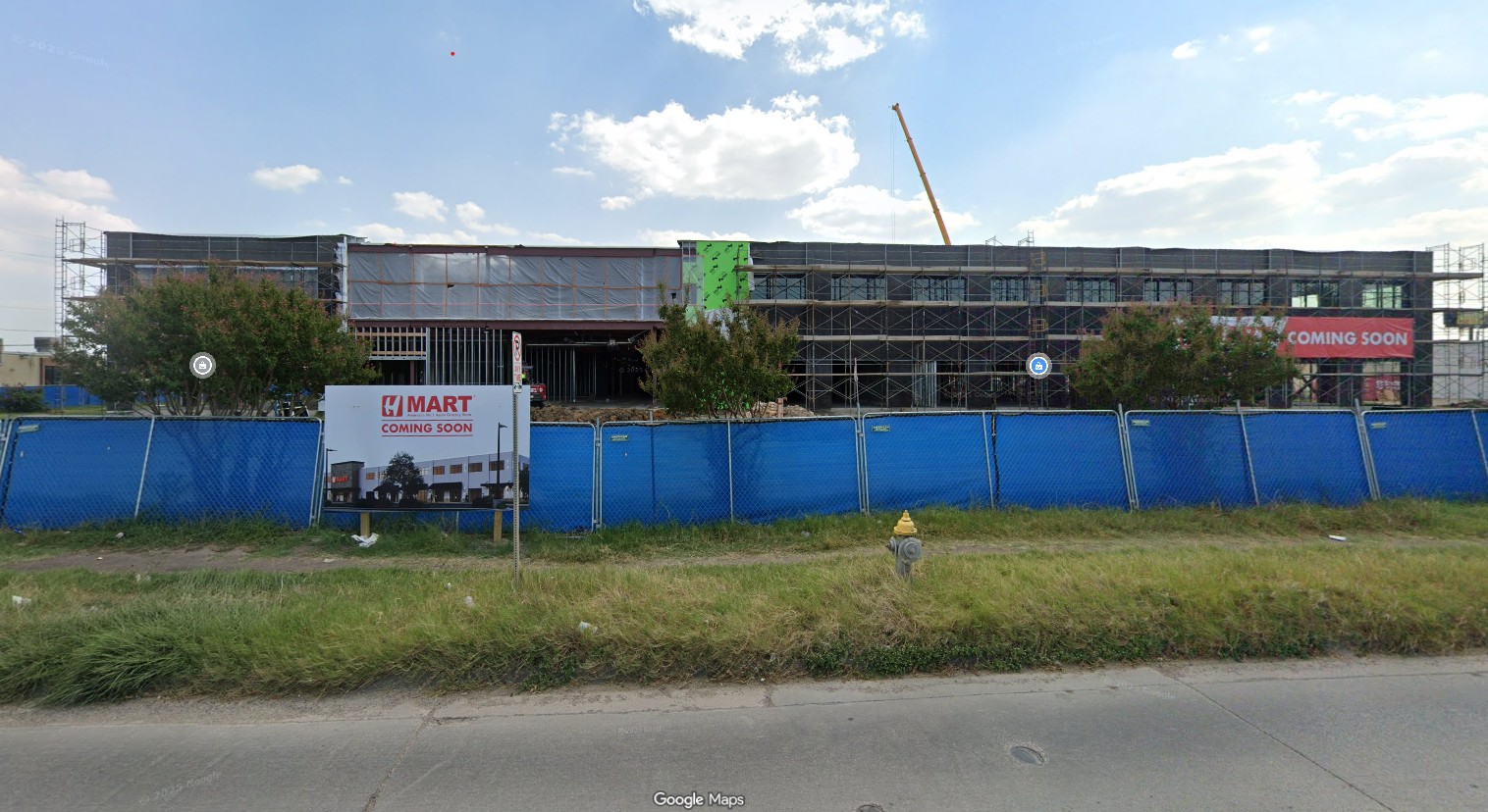 Construction site of new H Mart Dallas Koreatown location with “Coming Soon” panel visible on Royal Lane
