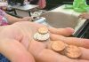 Pennies Vanish from Circulation, Leaving U.S. Shoppers Shortchanged Customer counts penny change at a Koreatown Los Angeles market amid U.S. penny shortage