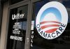 Covered California Premiums Could Triple as Congress Stalls on Tax Credits Obamacare logo displayed on the glass door of a UniVista Insurance office in Miami, linked to the Covered California premium increase debate.