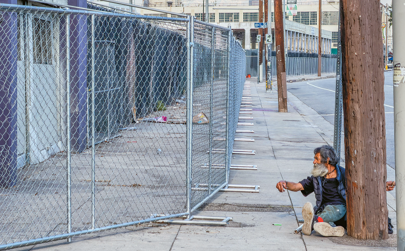Security fencing installed to reduce LA homeless fire risk at a Downtown Java Market building