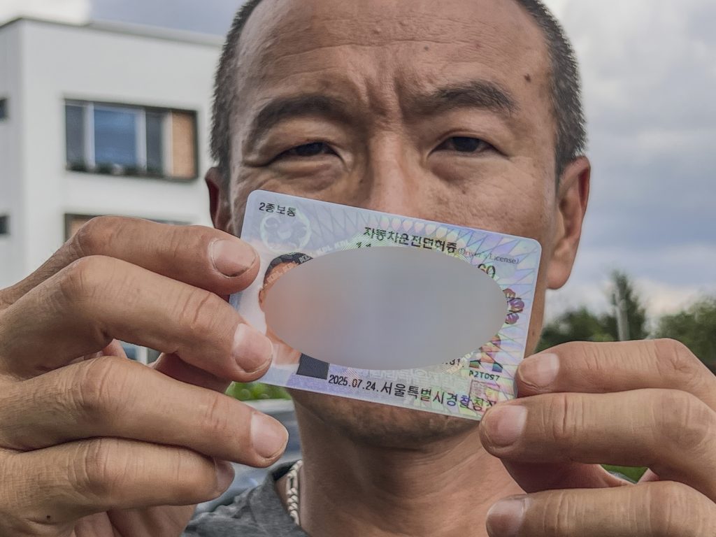 J.K. holds a newly issued South Korean driver’s license