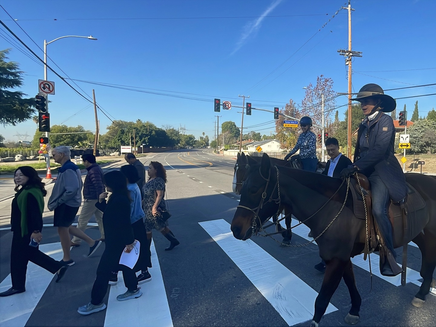 Korean American church-funded traffic light and crosswalk outside ANC Onnuri Church in Lakeview Terrace as residents cross the street