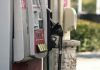 California gas price crackdown targets $9 fuel spikes a gas pump next to a brick wall